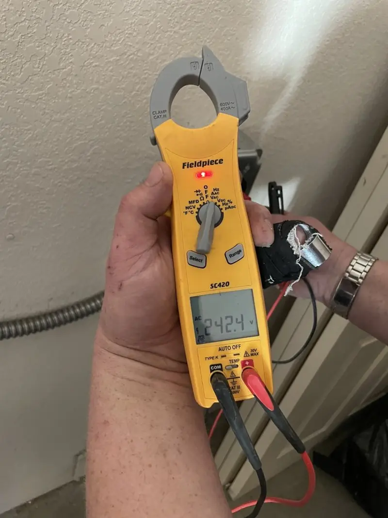 Voltage testing with clamp meter during Electrical Installation Services in Dunbar